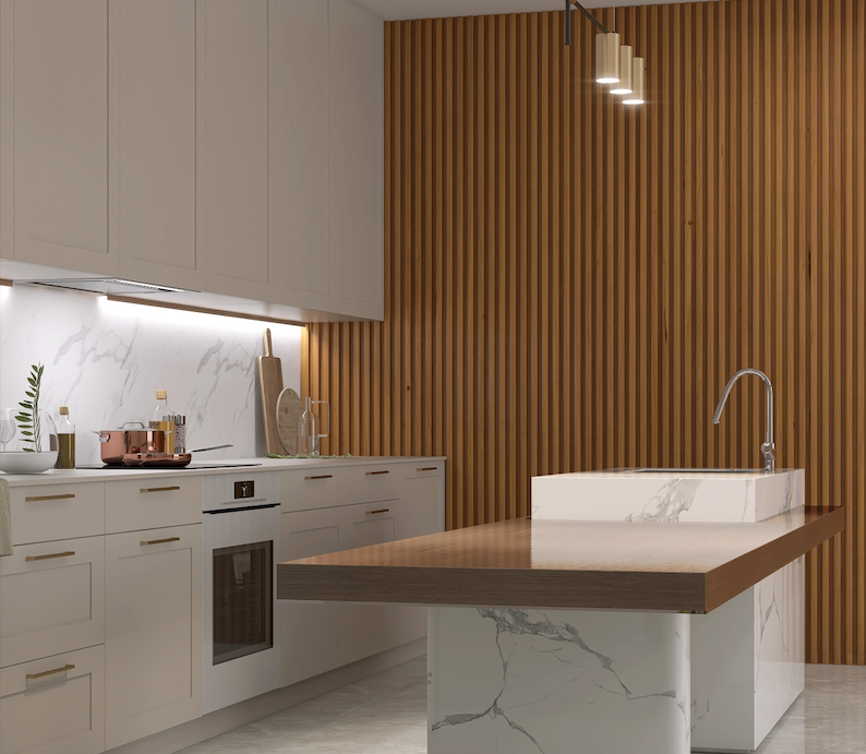 A modern kitchen featuring a warm wood-toned fluted panel feature wall that adds vertical texture behind a marble-topped island.   